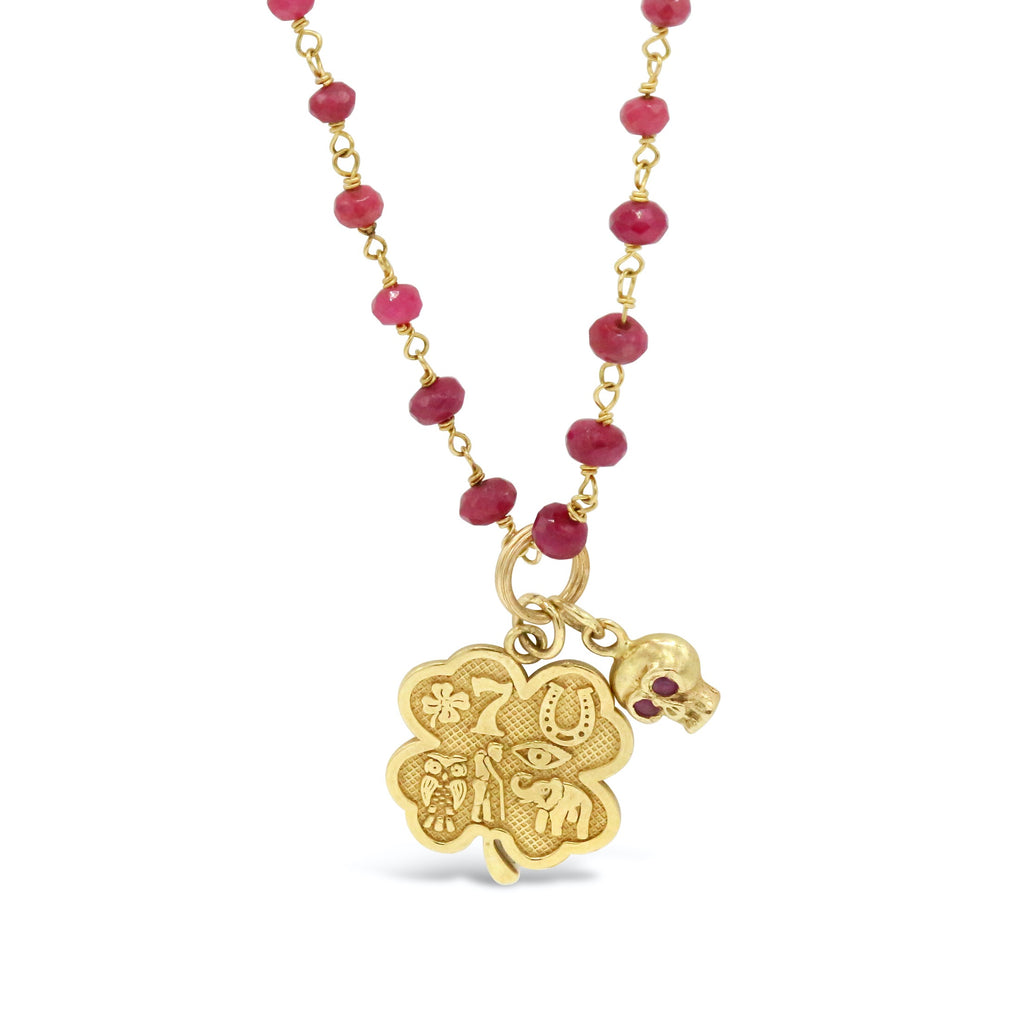 18 kt gold Ruby Rosary with Engraved Clover Pendant and Ruby Eyed Skull Necklace