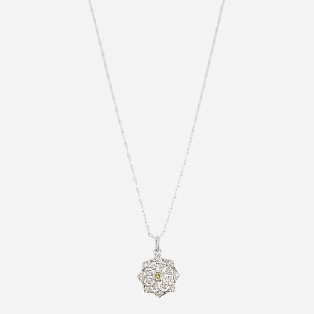 Antique style diamond pendant with yellow sapphire accent