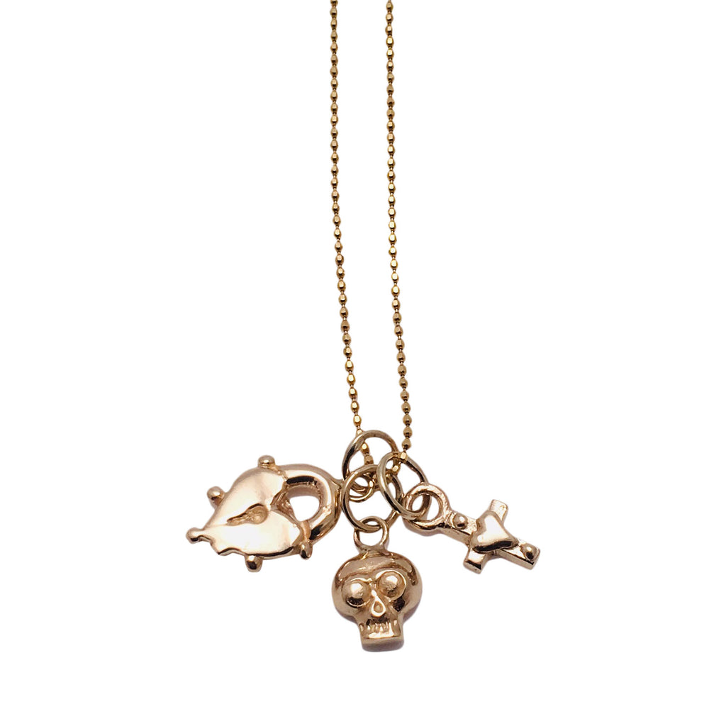 Gold Necklace with triple gold charms; Heart shaped gold lock, gold skull and mini gold Heart cross